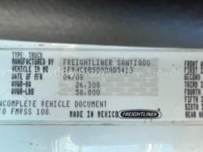 Vehicle data plate showing TYPE: TRUCK, MANUFACTURED BY FREIGHTLINER SANTIAGO; VEHICLE MADE IN MEXICO; VIN 1FVHCYBS09DAD5413; DATE OF MFG 04/08; GVWR 26,308; GVWR-LBS 58,000; COMPLETE VEHICLE DOCUMENT MADE IN MEXICO; FREIGHTLINER badge.
