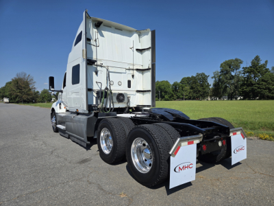 International LT gasoline truck tractor rear/side view showing dual rear axles and mud flaps.