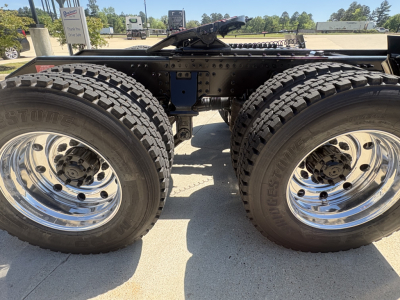  Volvo VHD64FT300 tractor rear dual rear wheels and chassis view showing dual tires and chrome rims.