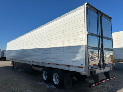 2016 Utility Reefer trailer side and rear view showing aluminum exterior, dual rear doors, and wheel axles. VIN 1UYVS2538GM454113