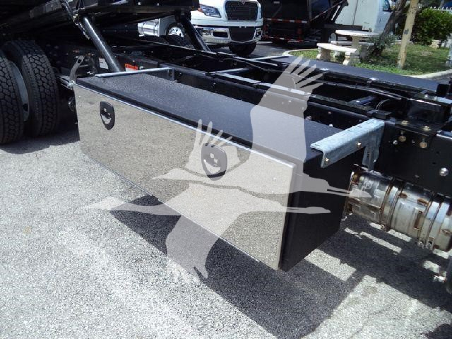 Truck chassis with a large rectangular toolbox mounted on the frame; no visible text readable on the toolbox or nearby components.