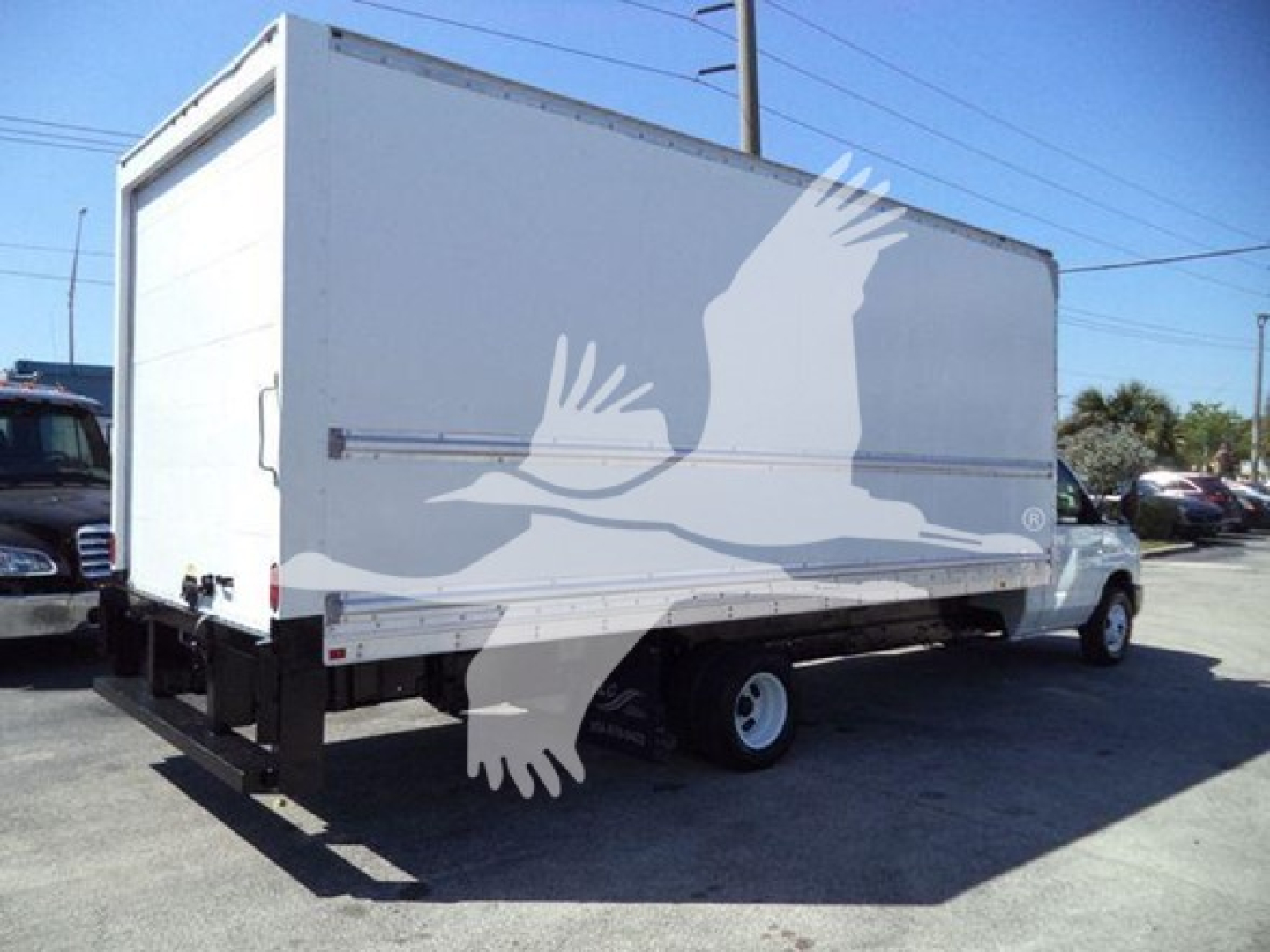 Box truck rear and side view showing cargo box and Ford E-450 chassis