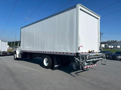 Freightliner M2 106 Plus box truck rear three-quarter view showing cargo box and rear underride guard.