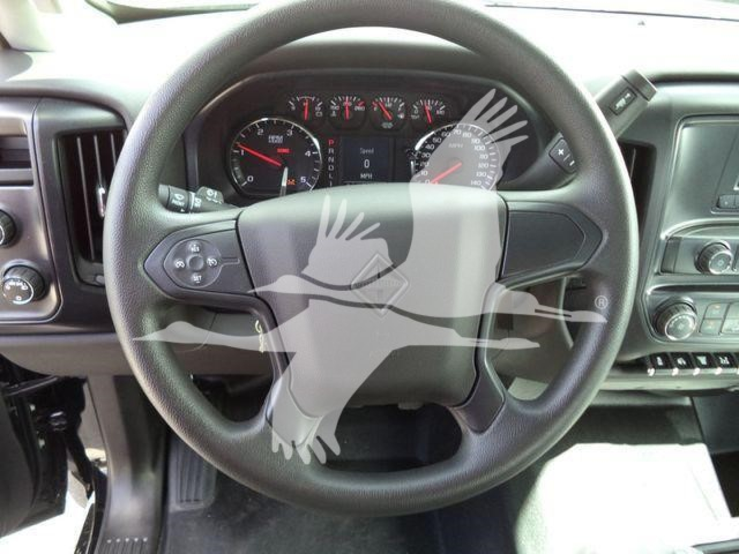 Steering wheel view from a 2023 International CV truck cab with dashboard gauges visible.