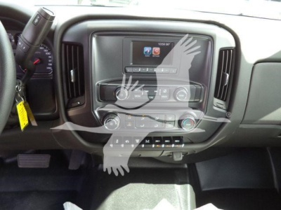 Dashboard of a 2023 International CV roll-back truck showing center multimedia display and climate controls.