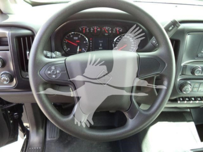 Steering wheel view from a 2023 International CV truck cab with dashboard gauges visible.