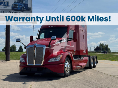 Kenworth T680 conventional sleeper semi truck in red parked outdoors with banner text 'Warranty Until 600k Miles!'