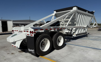 Dump trailer showing white skeleton-frame Armor Lite SBD40 with dual rear axles and dump bed.