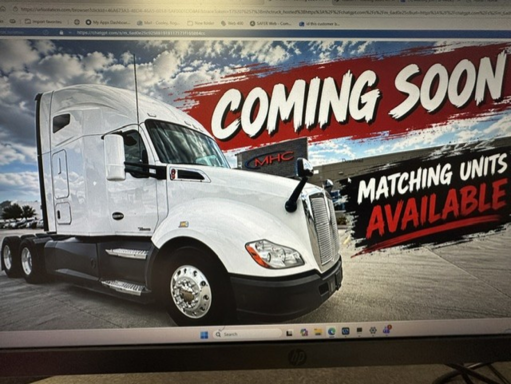 Truck engine bay area? No, image shows a white Kenworth T680 tractor with a large sleeper cab and front grille. Text on banner reads 'COMING SOON' and 'MATCHING UNITS AVAILABLE' in background.