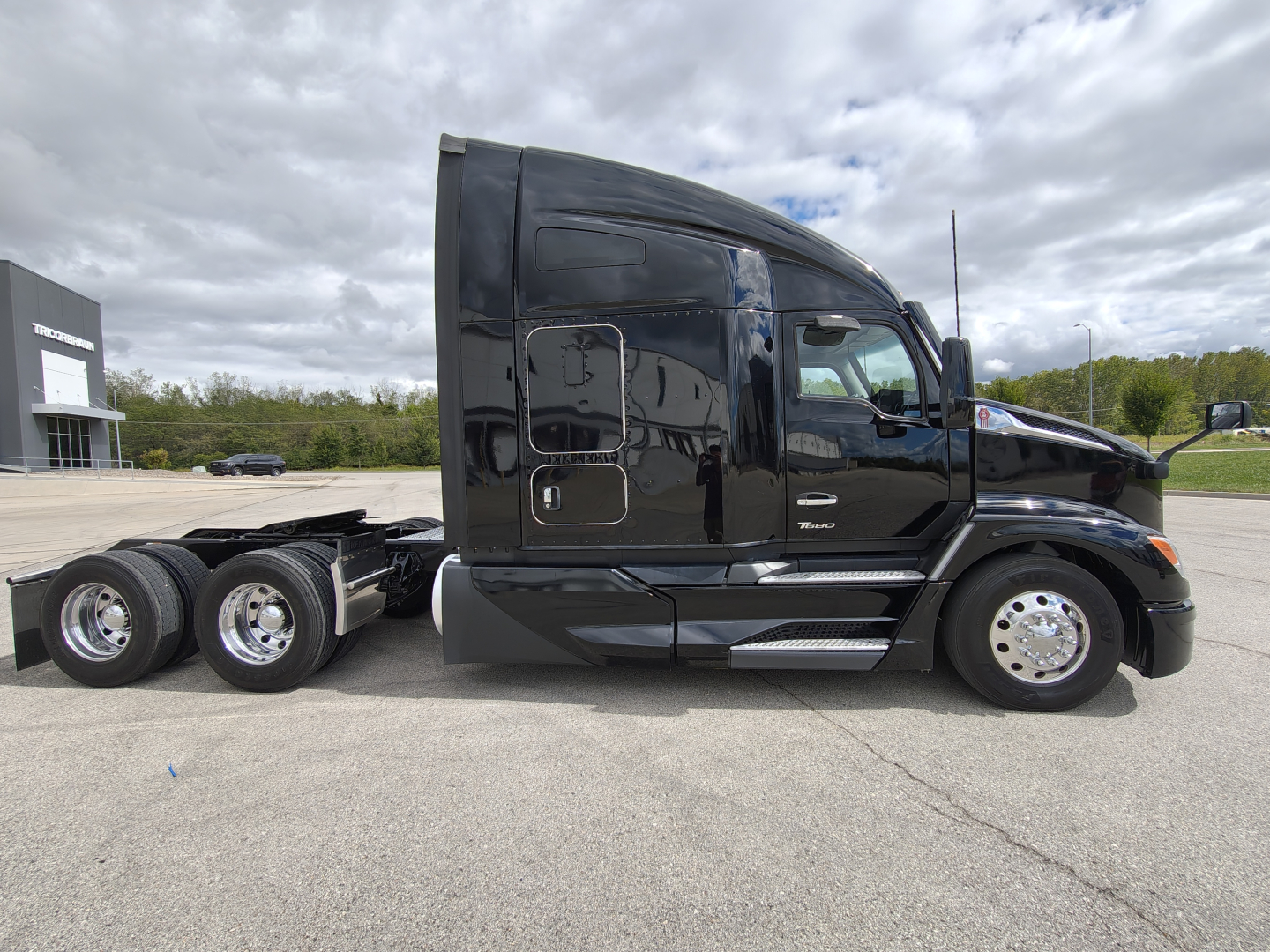 Kenworth T680 truck in profile view showing sleeper cab and rear wheels.