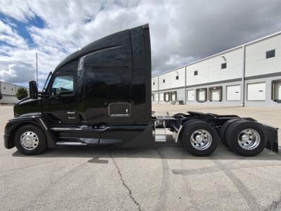 Kenworth T680 conventional sleeper truck side view showing cab and chassis with dual rear axles.