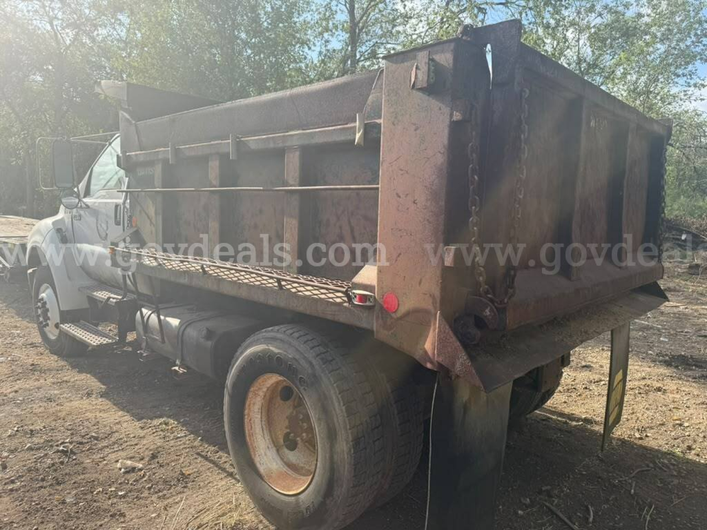 Ford F-750 dump truck bed showing rust in service/utility vehicle.