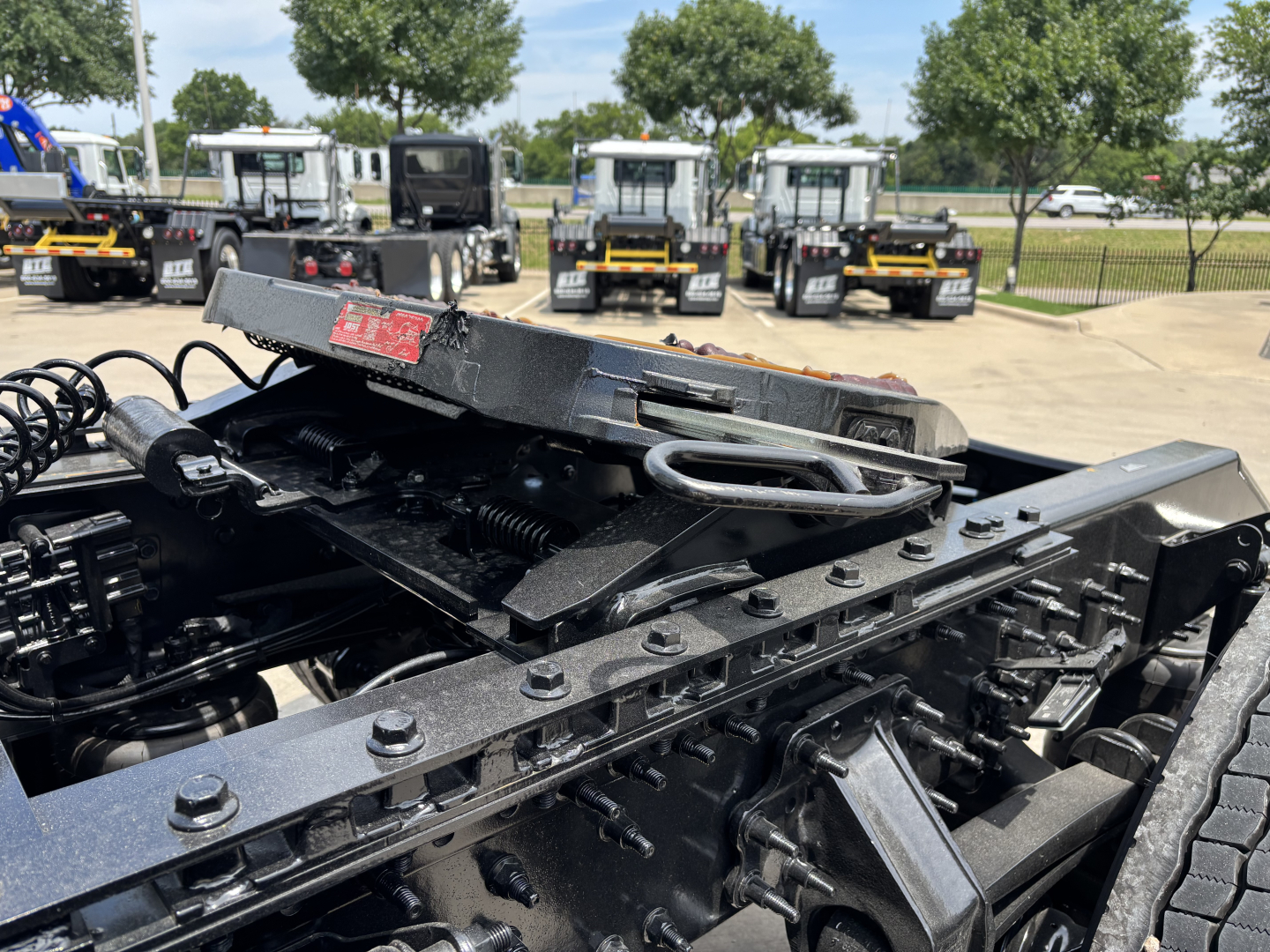 Volvo VNL64T860 truck chassis core with exposed frame and mounting brackets, black painted metal beams, hydraulic lines, and exposed fasteners.