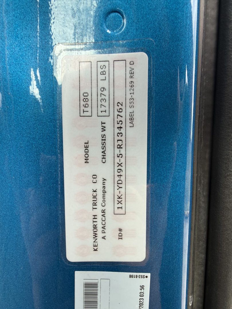 Kenworth T680 chassis data plate showing model T680, weight 17379 LBS, VIN 1XKYD49X5RJ345762, stock 0632545, label text visible.