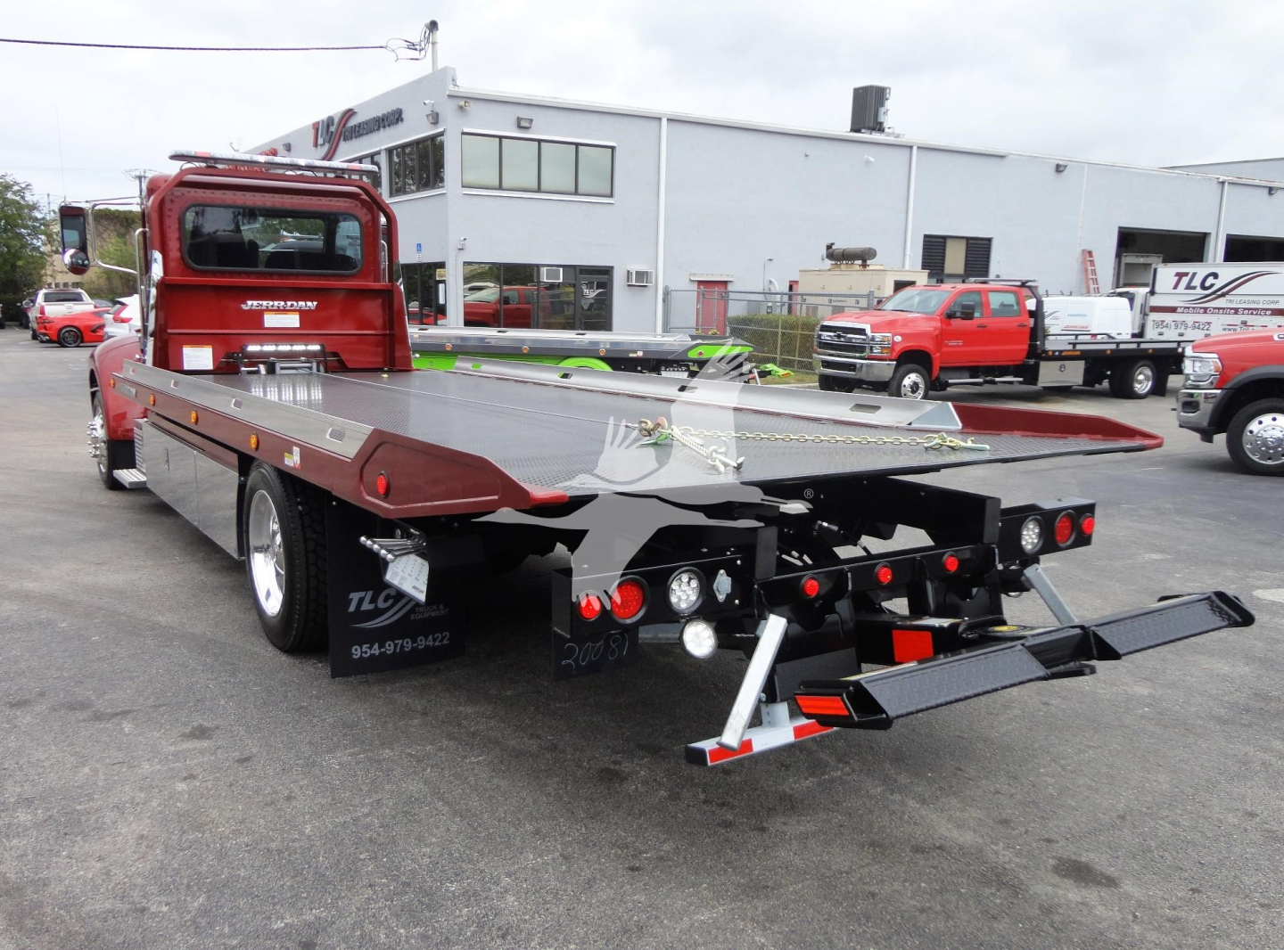 Peterbilt 337 rollback truck rear view showing flatbed and tow equipment