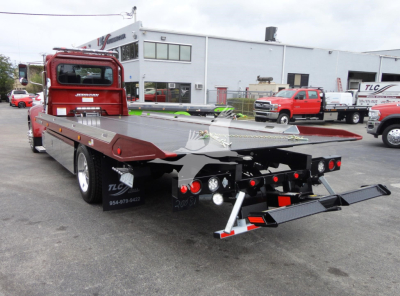 Peterbilt 337 rollback truck rear view showing flatbed and tow equipment
