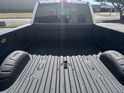 Ford F-350 truck bed view with cargo area and wheel wells visible.