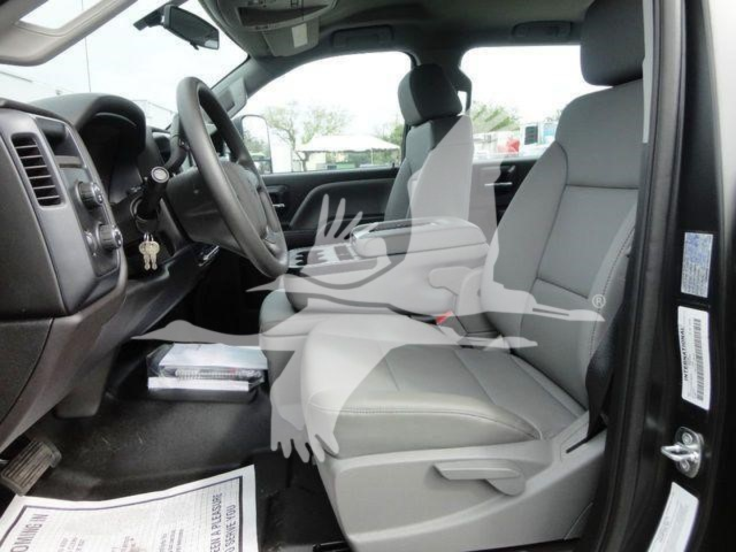 Cab interior of a 2023 International CV truck showing front seats and dashboard.