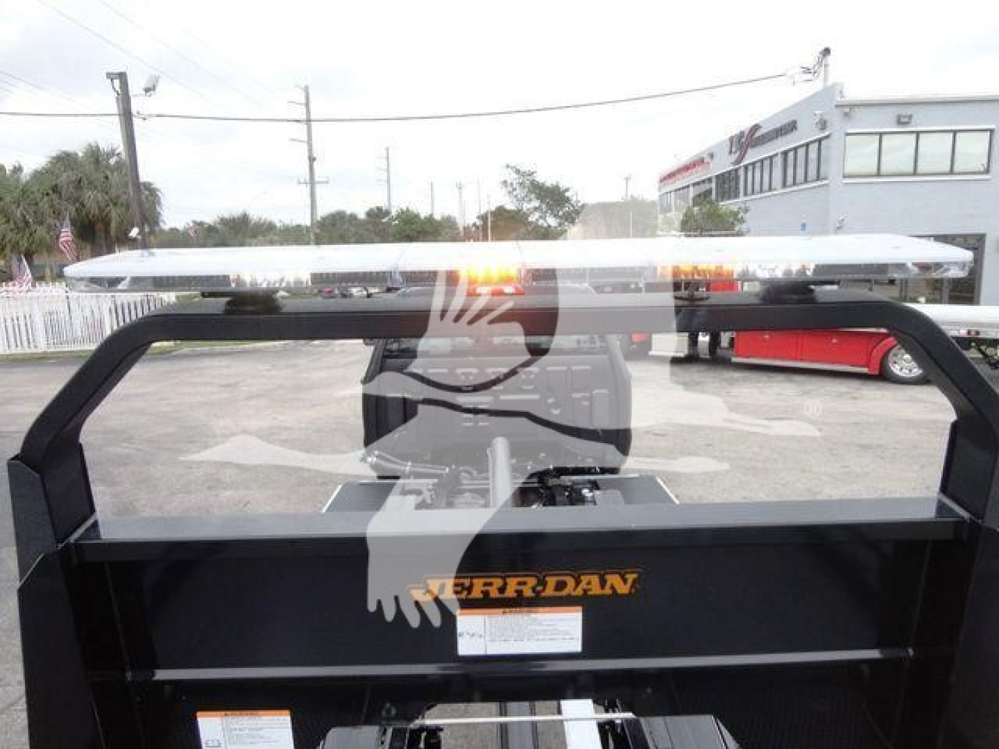 Truck bed with a metal rack and light bar showing the Ferran logo on the side.