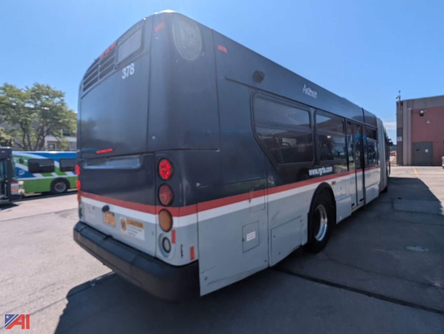 Transit bus rear view showing XD60 New Flyer and white/red graphic livery.