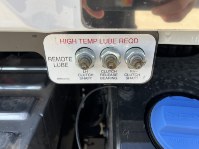 Plate showing high temp lube reqd with three bolts labeled LH clutch shaft, clutch release bearing, RH clutch shaft; blue reservoir cap nearby.