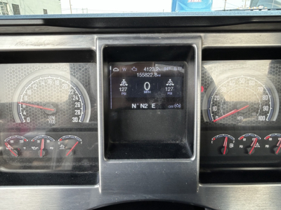 Mack GR64B dashboard with digital display showing key stats, speedometer, gauges, and center screen readings.