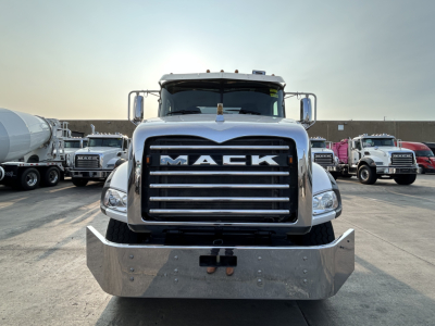 Front view of a 2020 Mack GR64B mixer truck showing large chrome grille with MACK lettering and heavy metal front bumper.