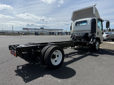 Isuzu NPRGASHD cab and chassis with raised cab, rear chassis exposed, dual rear wheels, and front cab lights.