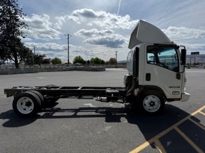 Isuzu NPRGASHD cab and chassis side view showing empty chassis frame and cab with raised roof, gasoline engine area visible.