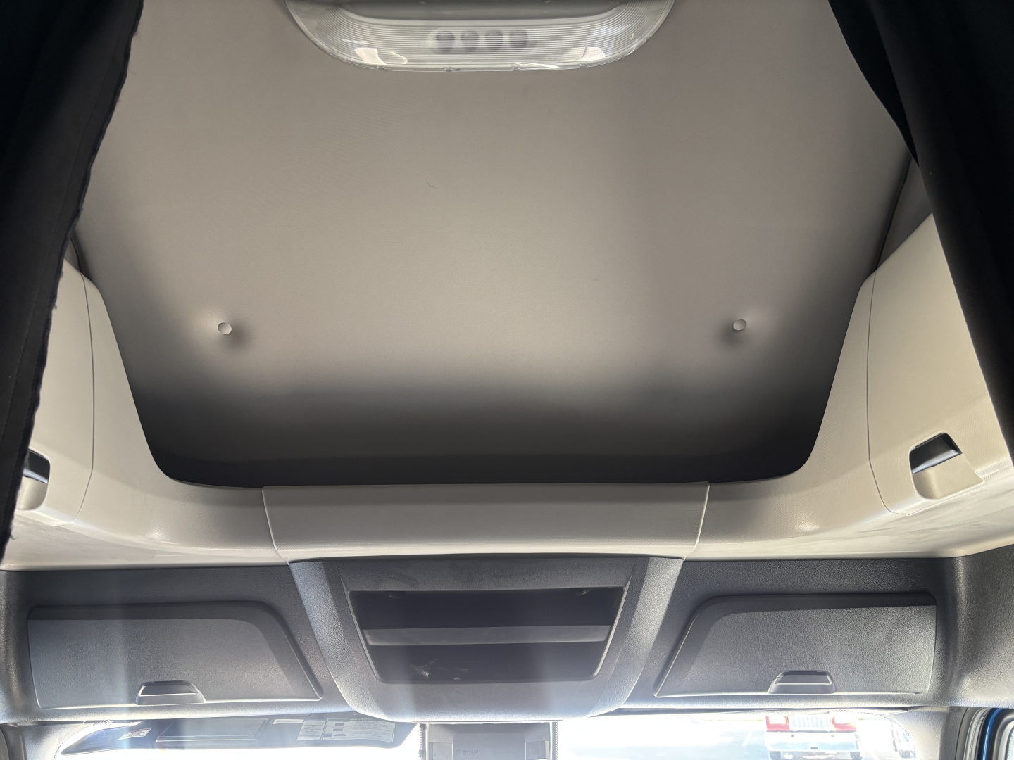 Cab interior view of a 2023 Freightliner PT126064ST sleeper truck showing overhead dash area and ceiling panel.
