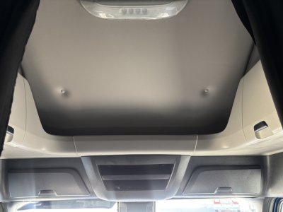 Cab interior view of a 2023 Freightliner PT126064ST sleeper truck showing overhead dash area and ceiling panel.
