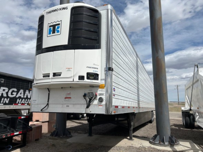 Thermo King refrigerated trailer front end and turntable legs of a 2026 Utility 3000R reefer trailer showing Thermo King unit and raised landing gear.