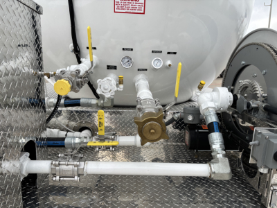 Mack MD7 truck component image showing fuel/air lines, valves, gauges, and piping arranged on a diamond-plate platform with yellow handles.