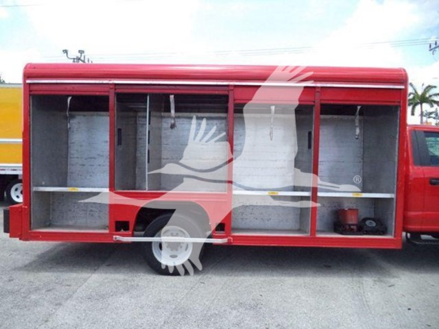 Ford F-550 service body truck with open compartments, red exterior, shelving inside. Visible text includes 2020 Ford F550 in listing context (not on the image itself).