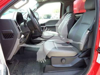 Ford F-550 interior driver and passenger seats in view, front cab with steering wheel and dashboard, light gray cloth seats.