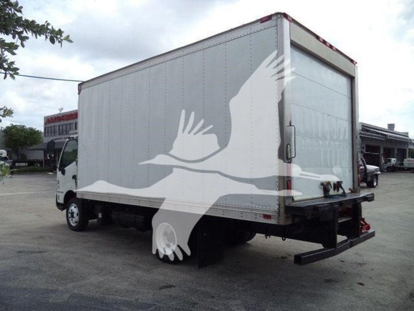 Rear three-quarter view of a 2019 Hino 195 refrigerated truck with a tall cargo box.