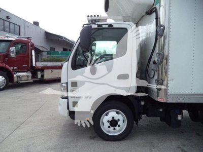 2019 Hino 195 refrigerated box truck cab-side view showing front wheel and cargo area.