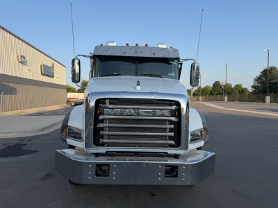 Grille view of a 2027 Mack GR64B front truck showing large grille, bumper, headlights, and mirrors.