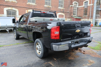 Chevrolet Silverado 2500HD Crew Cab pickup truck rear view showing bed, taillights, hitch, and chrome bumper.