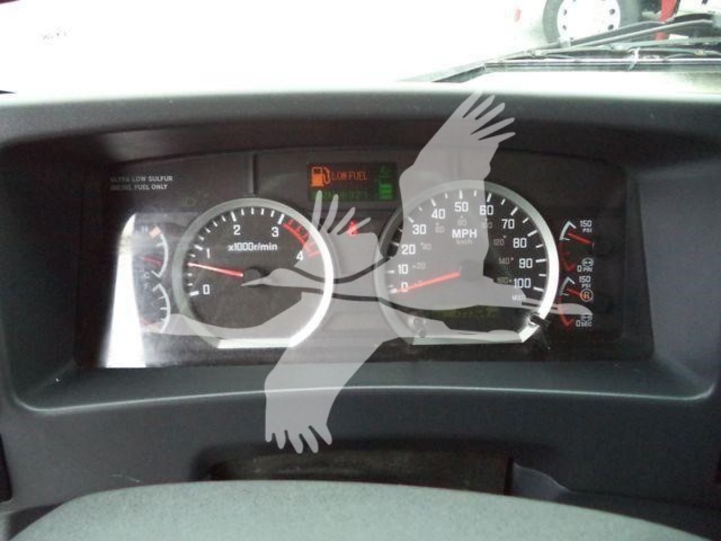Isuzu FTR dashboard showing tachometer, speedometer, and warning indicators.