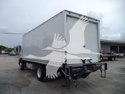 Isuzu box truck 2018 model shown from rear-left; cargo box with white paint, visible rear doors, undercarriage, and rear bumper/step.