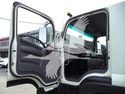 Isuzu 2018 FTR cab interior and open door showing dashboard and steering wheel.