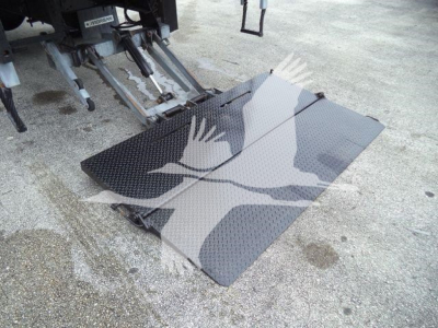 Isuzu box truck rear with hydraulic lift/loading ramp extended showing diamond plate platform