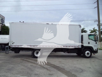 Isuzu FTR box truck side view showing large white cargo box and cab with front grille.