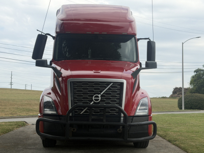 Volvo VNL64T760 truck front view showing grille, bumper guard, and Volvo emblem.