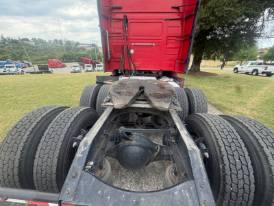 Rear view of a Volvo VNL64T760 tractor chassis showing dual rear axles, fifth wheel area, and drive tires.