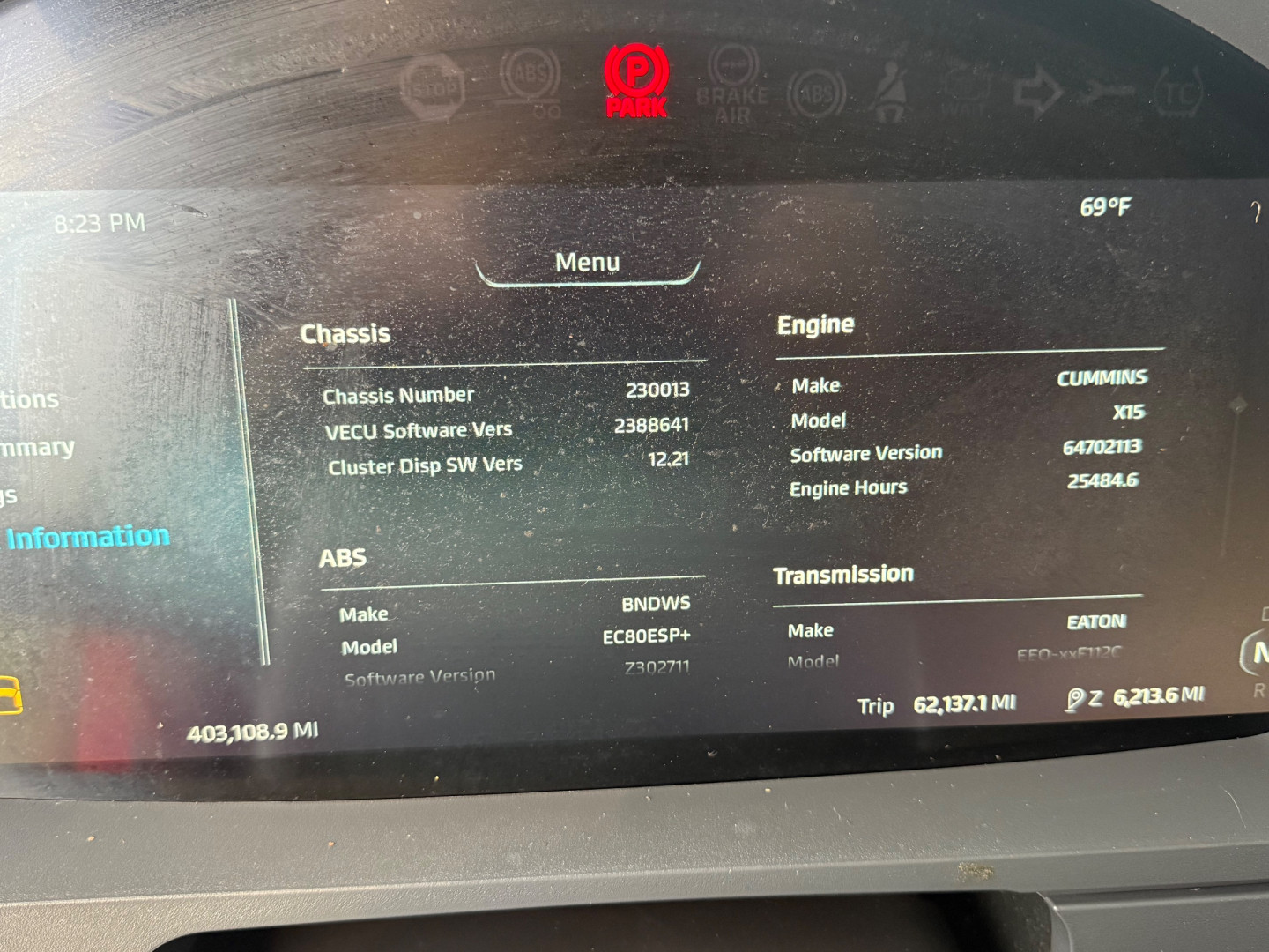 Kenworth T680 dashboard display showing chassis and engine details with ECU software, ABS, and trip data.