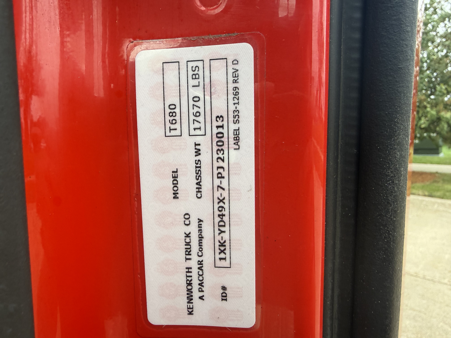 Kenworth T680 door jamb sticker showing model T880? Wait: sticker text vertical; includes Model, Chassis, See details: 'KNi' not clear