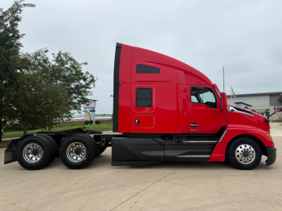 Kenworth T680 conventional sleeper truck side view showing cab and chassis with red paint and black lowers.