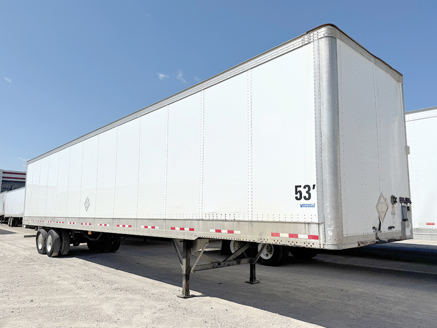 2016 Vanguard VXP trailer in a lot, side view showing 53' length text, front hitch and landing gear visible.